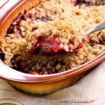 Banana crumble in bowl with spoon