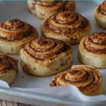 Cinnamon rolls on a baking tray