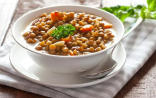 Lentil soup in a white bowl