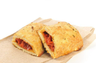 Mini calzones on a brown paper napkin with a white background.