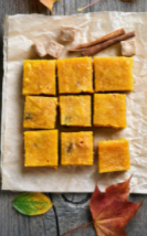 Nine pumpkin squares with a cinnamon stick.