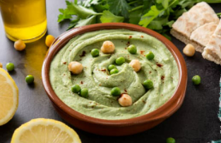 A brown bowl of split pea hummus