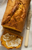 Sliced squash bread with butter.