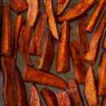 Baking sheet with sweet potato fries.