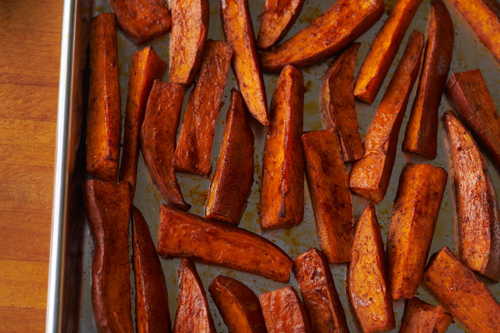 Baking sheet with sweet potato fries.