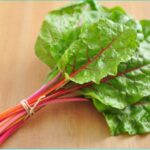 Swiss chard on wooden table