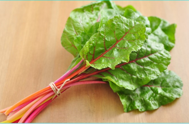 Swiss chard on wooden table