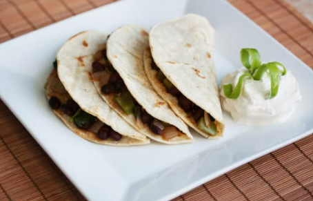 A plate of three tacos