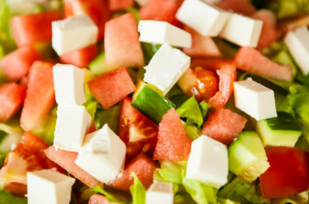 Tomatoes, cucumbers, and feta cheese mixed together.