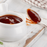 BBQ dipping sauce in a small white bowl