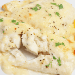 Closeup view of baked haddock with lemon