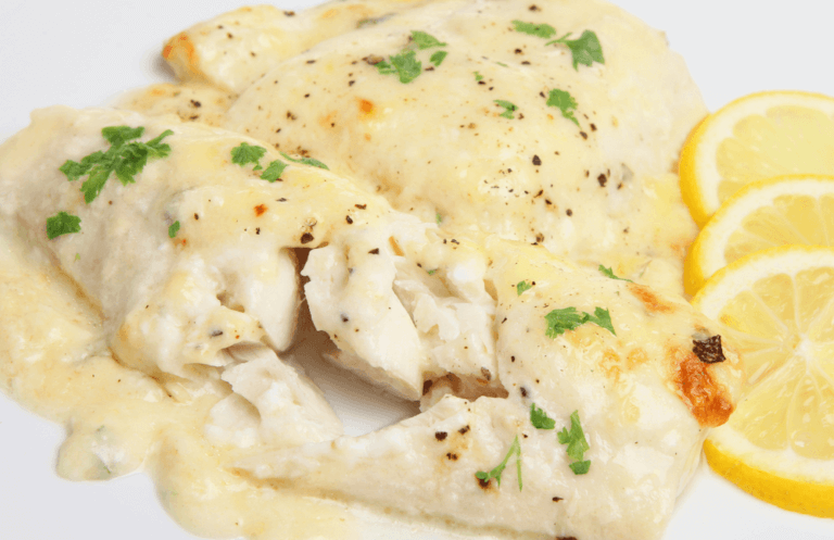 Closeup view of baked haddock with lemon