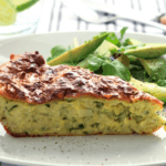 One piece of zucchini pie on a white plate.