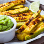 sliced zucchini fries with cup of guacamole