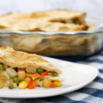 One slice of chickpea pot pie on a white plate.