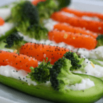 Cucumber canoes filled with carrots and broccoli.