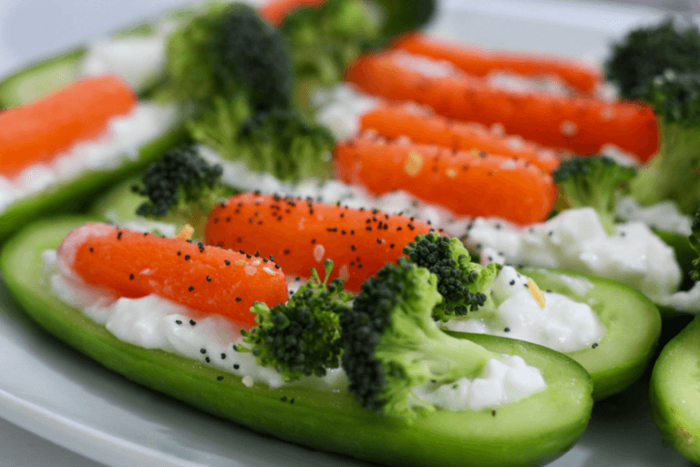 Cucumber canoes filled with carrots and broccoli.