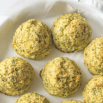 Summer squash tots on a tray covers with parchment paper.