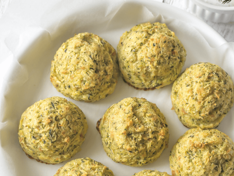 Summer squash tots on a tray covers with parchment paper.