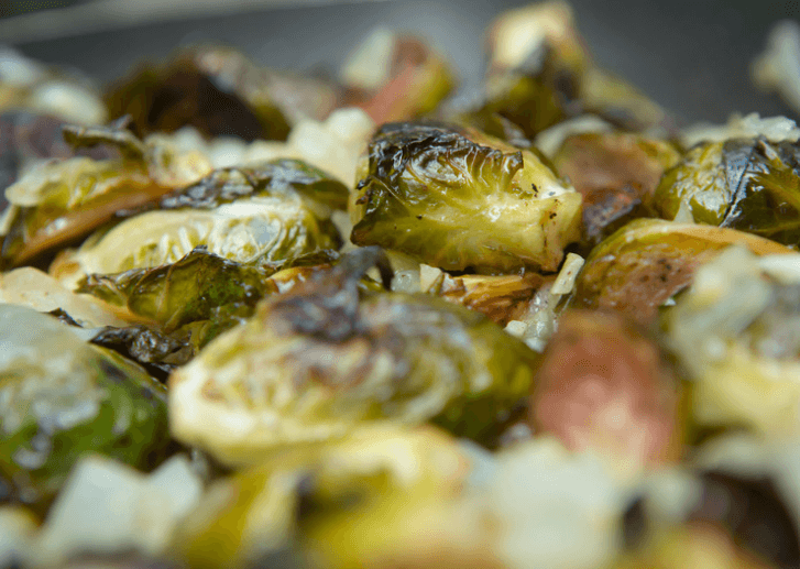 A lot of zesty brussels sprouts in a pan.