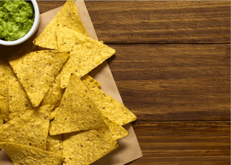 Tortilla chips with a side of guacamole.