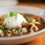 Shredded Chicken stew topped with barley.