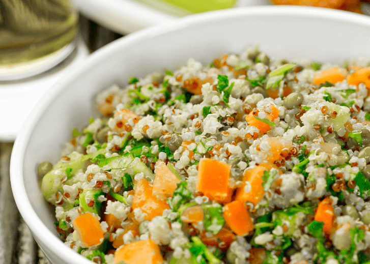 Quinoa, sweet potato dish in a white bowl.