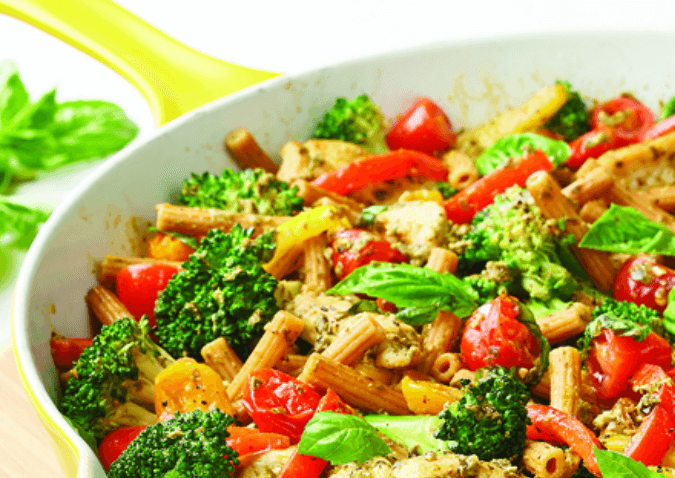 Chicken, Tomatoes, Spinach, and Pasta in a Skillet