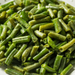 Sautéed Dutch Green Beans in a white bowl.
