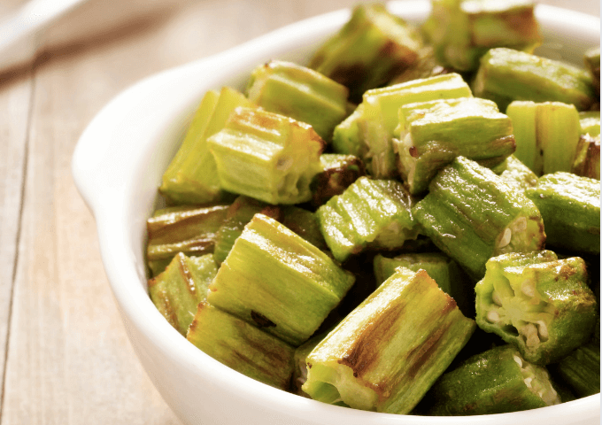 Diced okra in a white bowl.