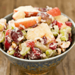 Apples, raisins, pears, and nuts salad.