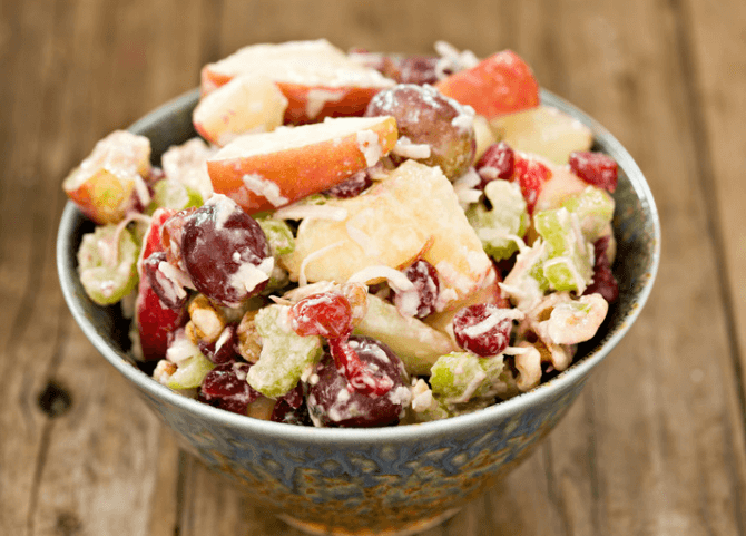 Apples, raisins, pears, and nuts salad.