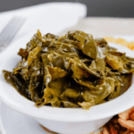 Collard greens in a white bowl.