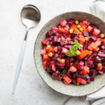 Pink beets, pea salad with a spoon.