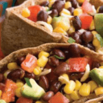 Black beans, corn, tomatoes in a pita.