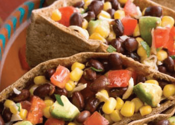 Black beans, corn, tomatoes in a pita.