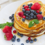 Stacked Pancakes with berries.