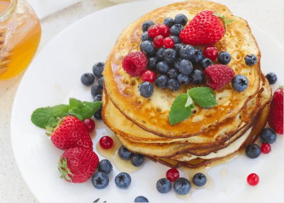 Stacked Pancakes with berries.