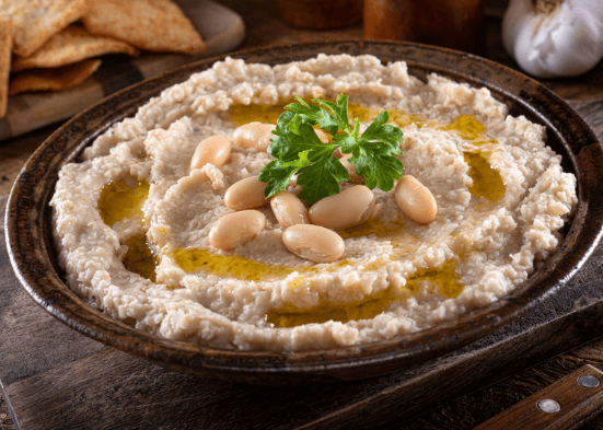 Pinto bean dip with pinto beans on top.