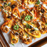 A baking tray of bell pepper nachos