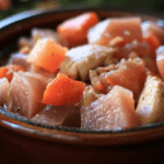 Diced chicken, rutabaga, and beets stew in a bowl.