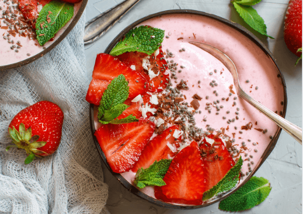 Strawberry smoothie bowl with strawberries in it.