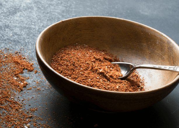 Taco seasoning in a bowl with a spoon.