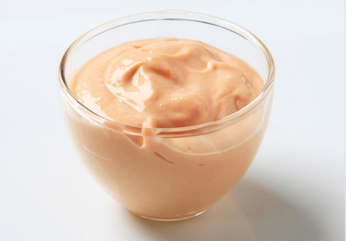 Yogurt dip in a clear glass bowl.