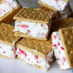 A small pile of strawberry ice cream sandwiches