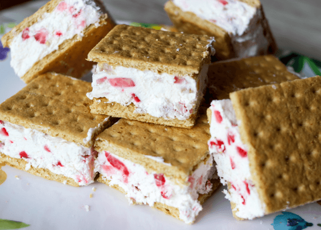 A small pile of strawberry ice cream sandwiches