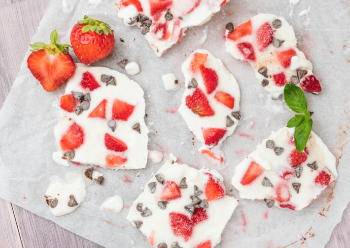 Frozen yogurt pieces with strawberries.