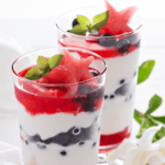 Two glasses of a berry parfaits