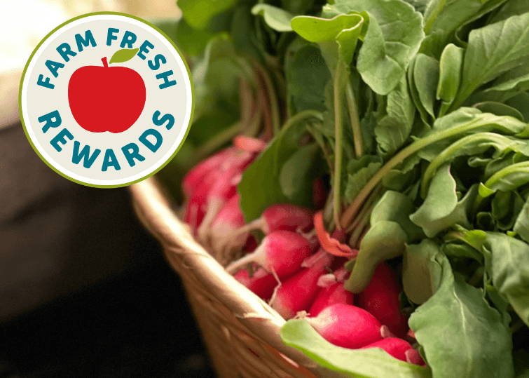 Bunch of radishes in a basket with the Farm Fresh Rewards logo in the top left corner