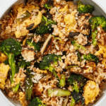A bowl of egg and broccoli fried rice